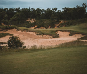 Golf hole with sand in front